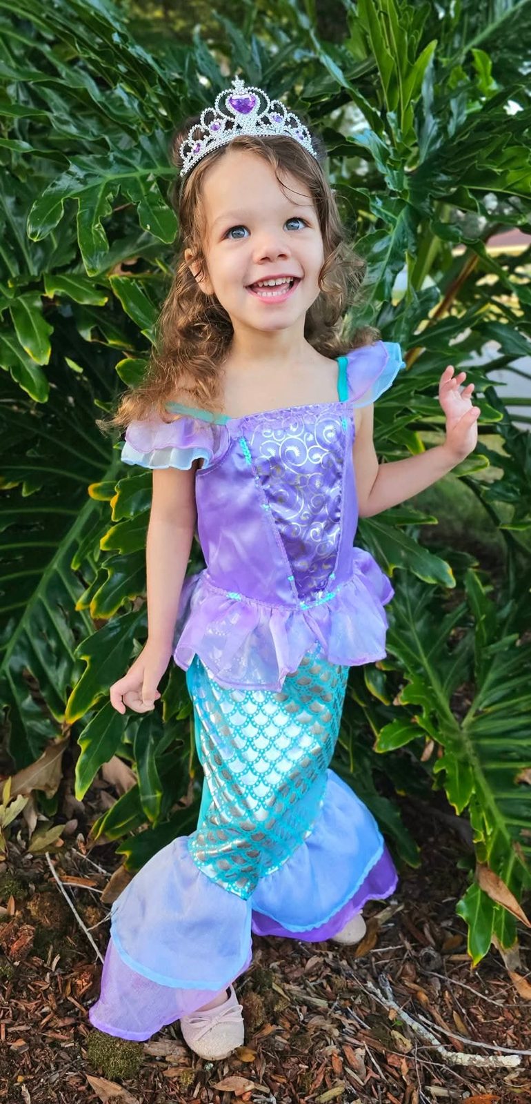 Girl in a mermaid costume and tiara