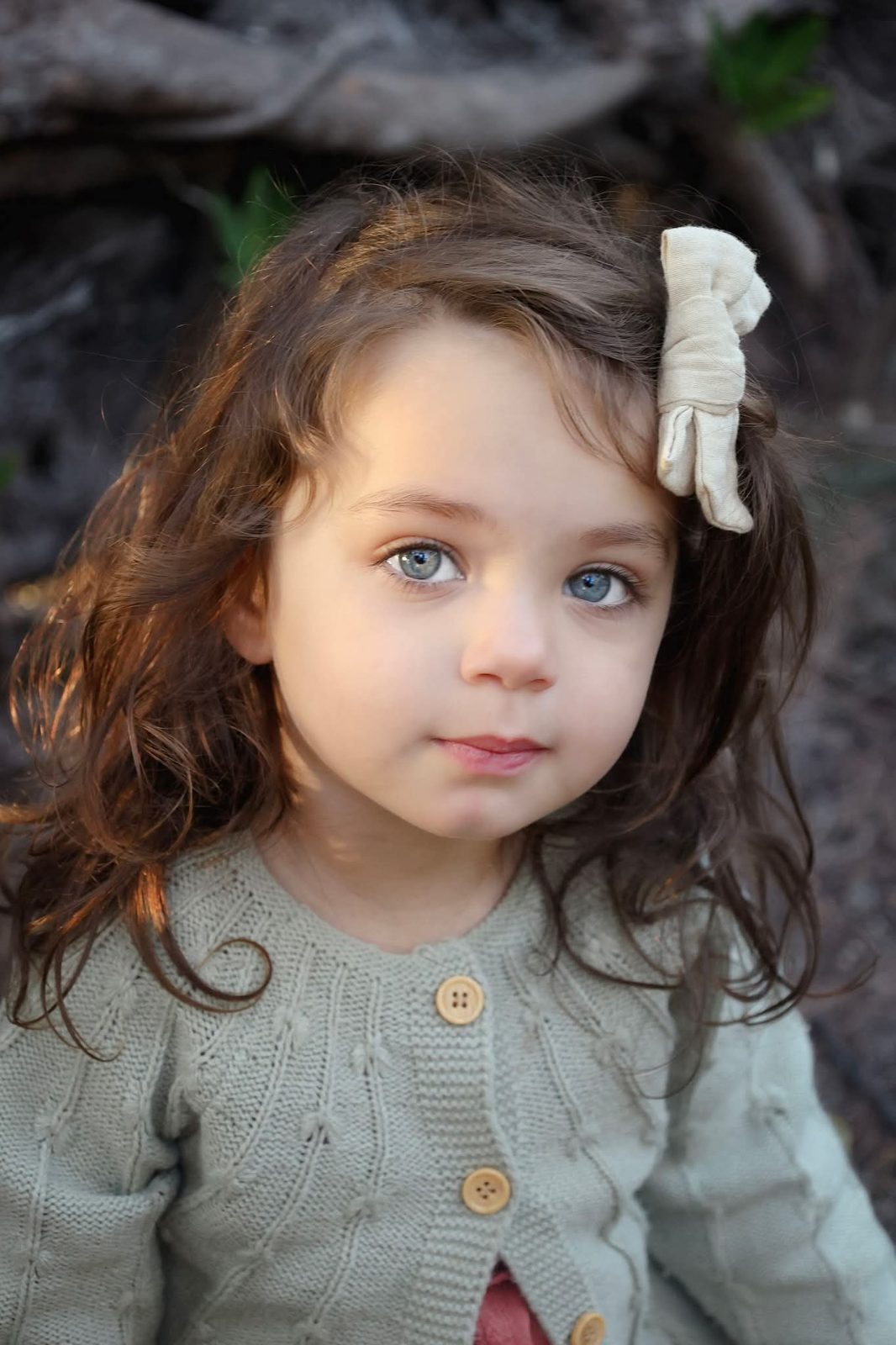 Girl in a sage cardigan in golden light